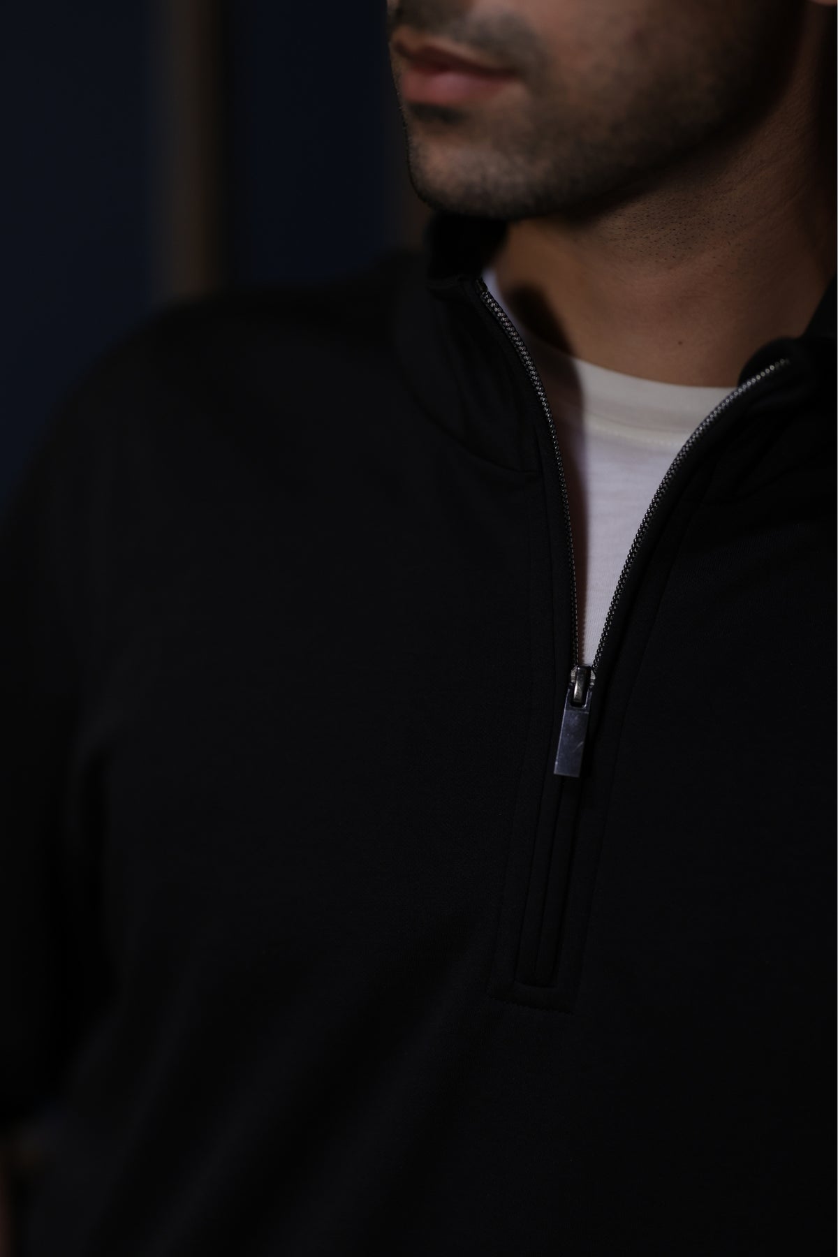 Black quarter-zip collar detail