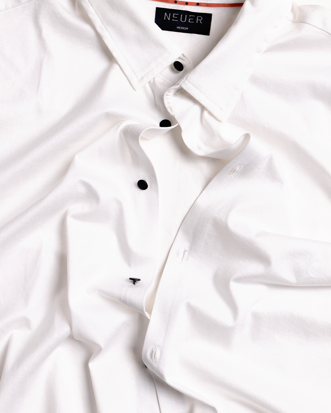 White NEUER polo and label detail