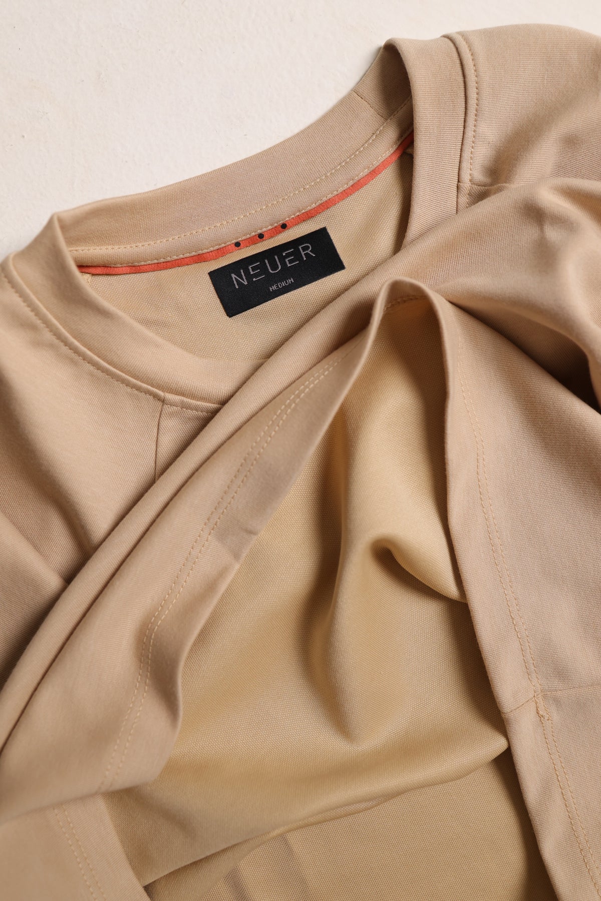 Ivory NEUER collar and red trim detail