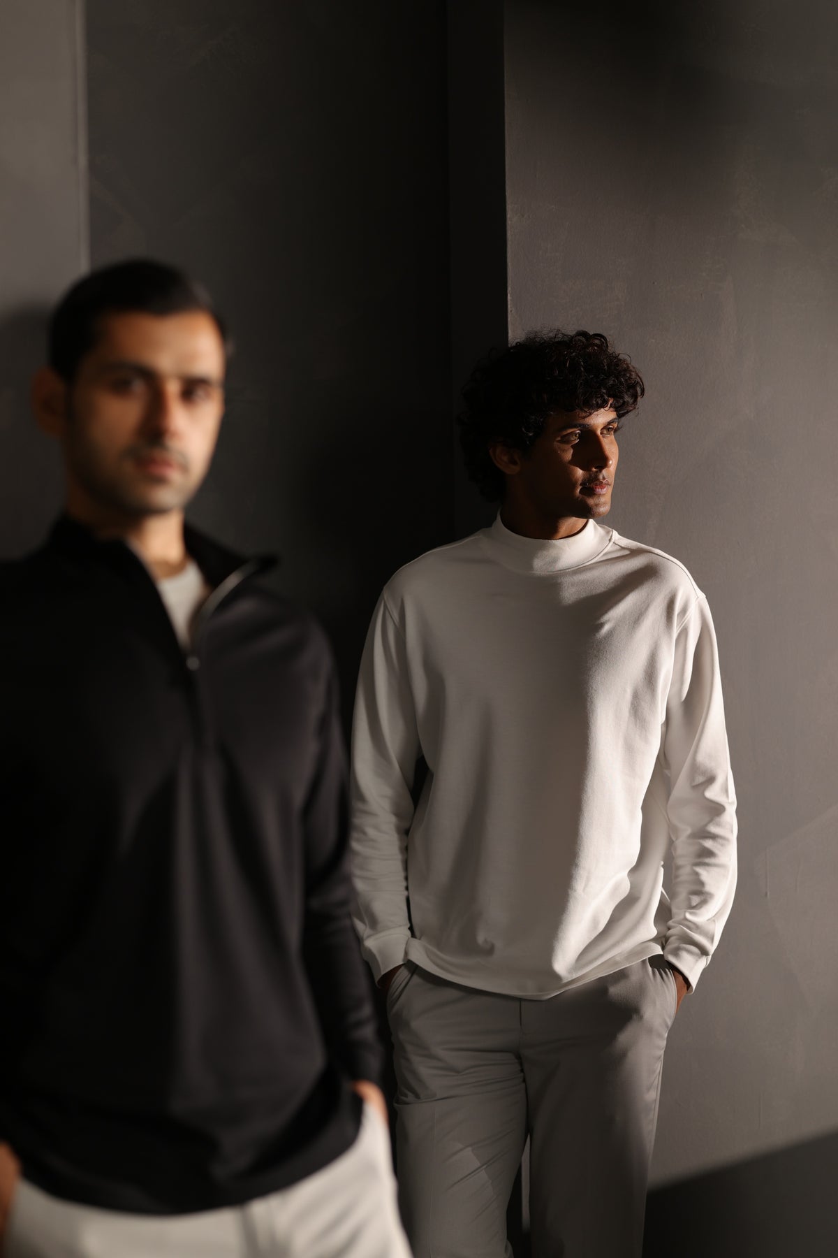 Two men wearing NEUER long-sleeved tops
