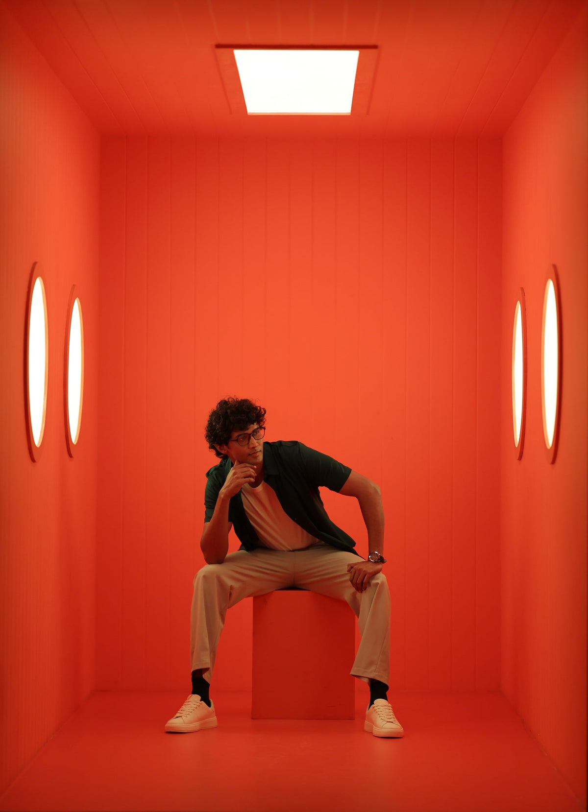 Man standing in an orange room