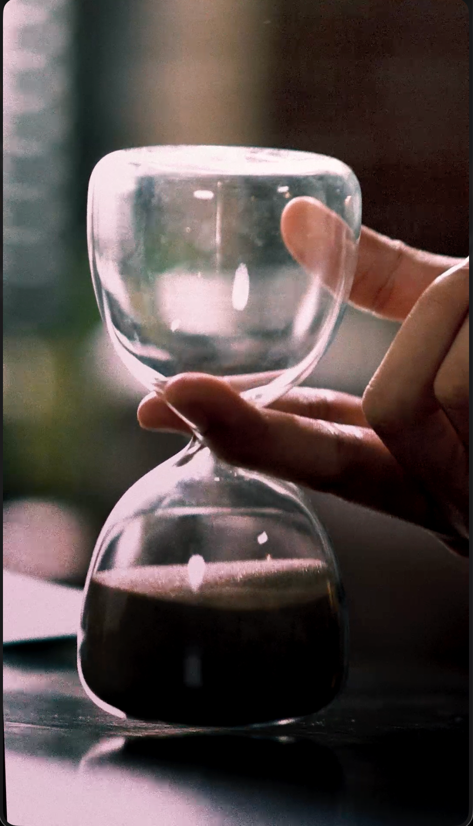 Pour-over coffee glass and hand